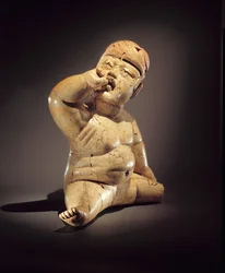 Babyfigur (Keramik, Zinnober und roter Ocker)